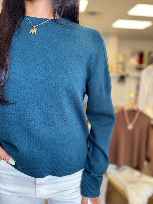 Deep teal sweater back view
