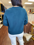Deep teal oversized sweater styled outfit
