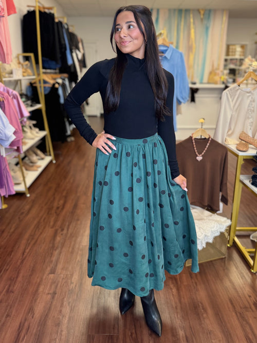 Teal polka dot swing midi skirt front view