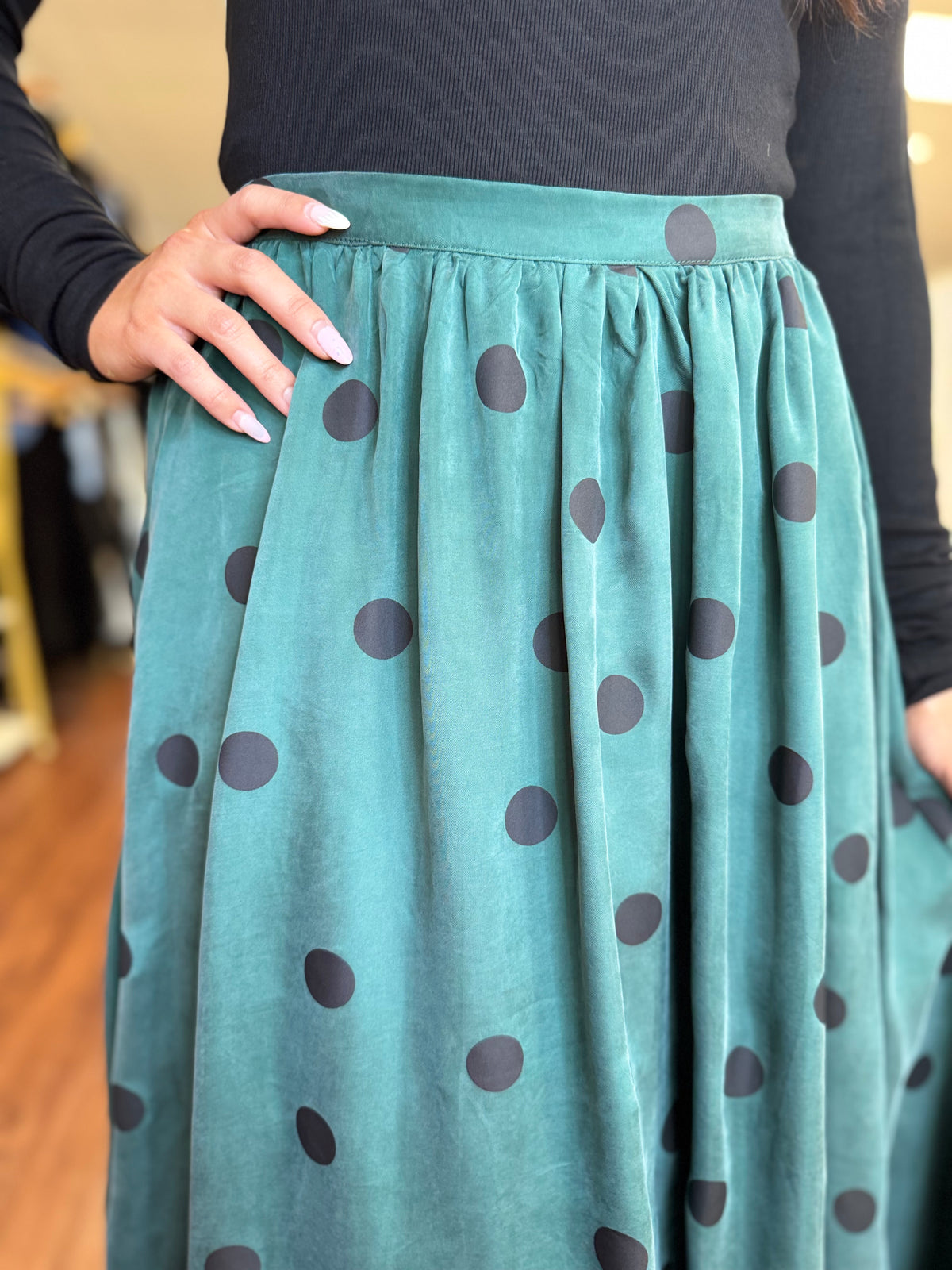 Teal polka dot midi skirt back view