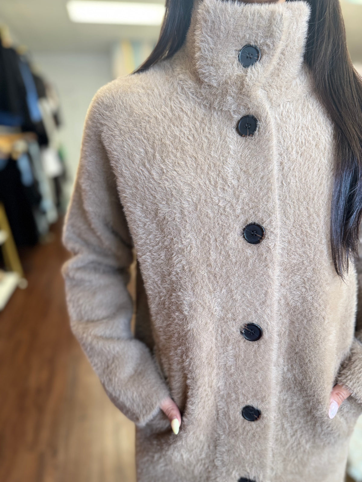 Tan long sweater jacket side view