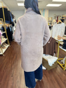 Tan sweater jacket side welt pocket detail